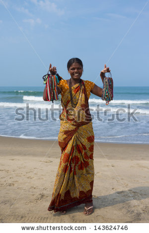 https://alexnika.net/wp-content/uploads/2013/06/stock-photo-morjim-goa-india-march-indian-women-in-traditional-dress-sells-souvenirs-on-the-beach-143624746.jpg